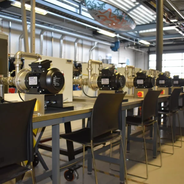 A picture of 5 smaller centrifugal pumps supplied by Tapflo to Fareham College for their trainee marine Engineer curriculum